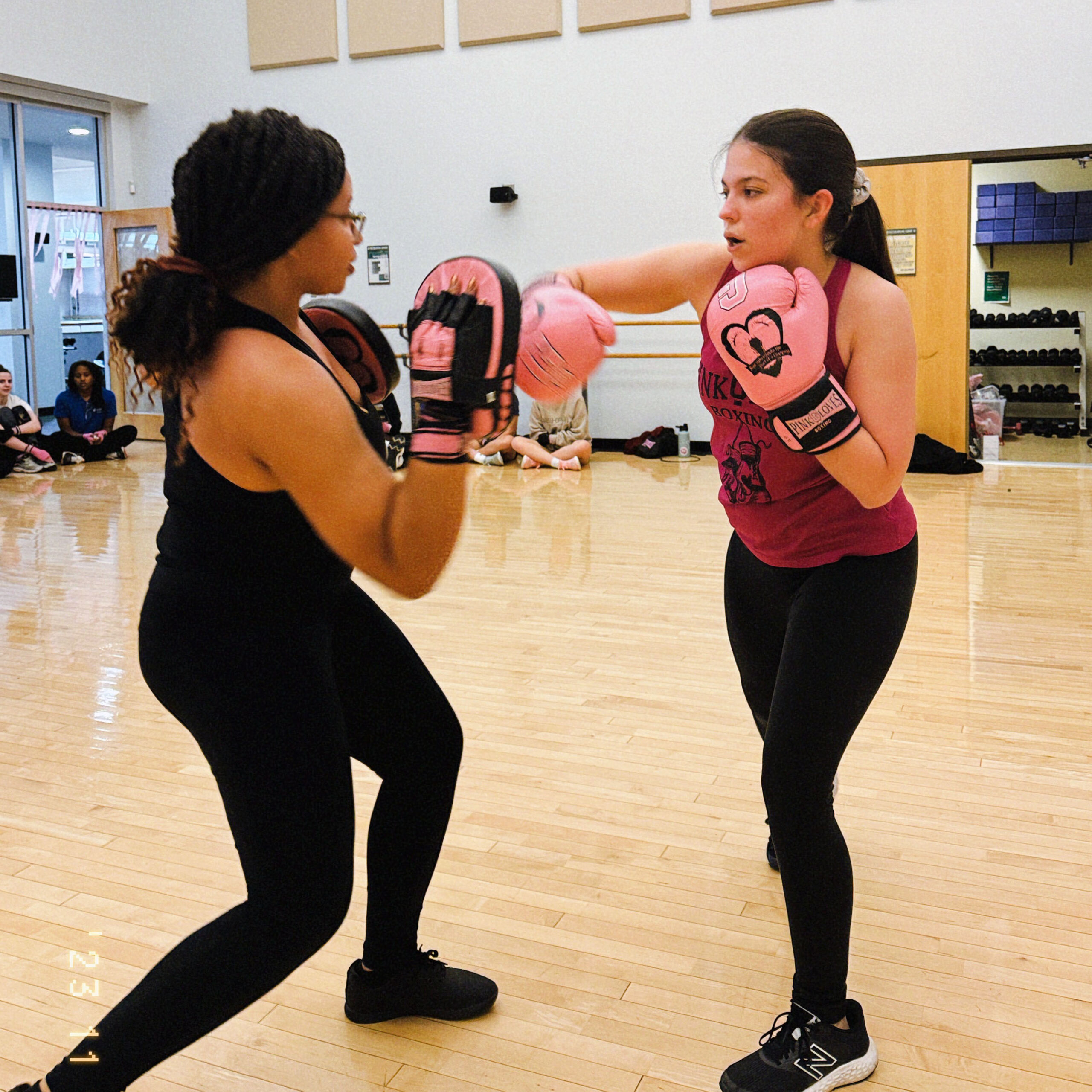 Two girls boxing.
