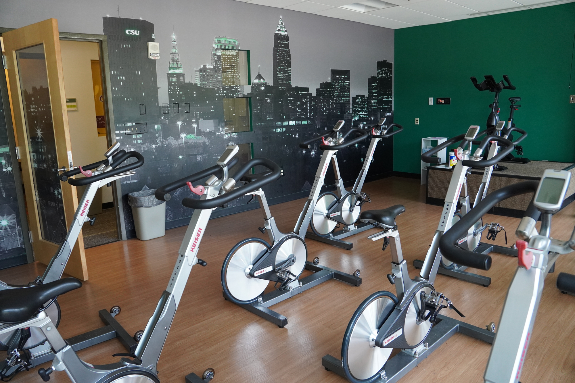 cycling studio with Cleveland skyline mural wall