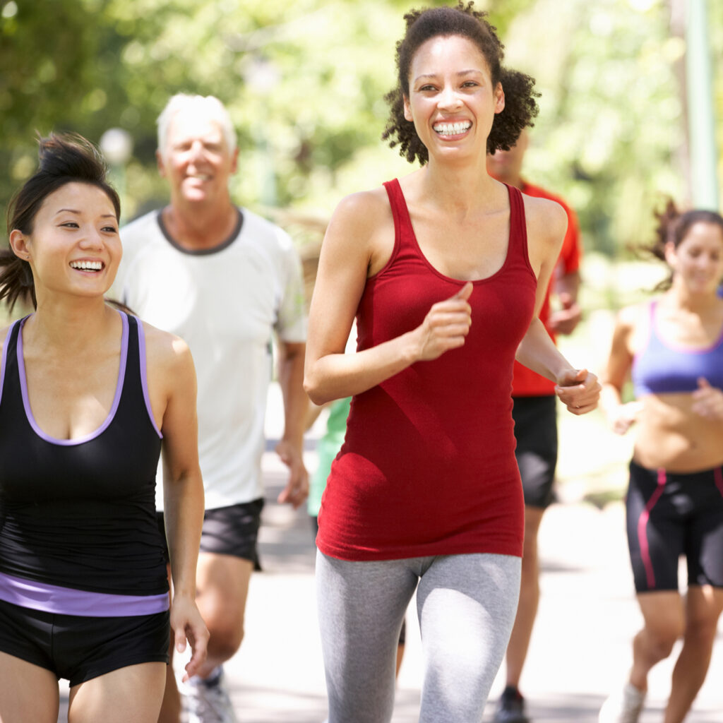 running group outside on a path on a sunny day