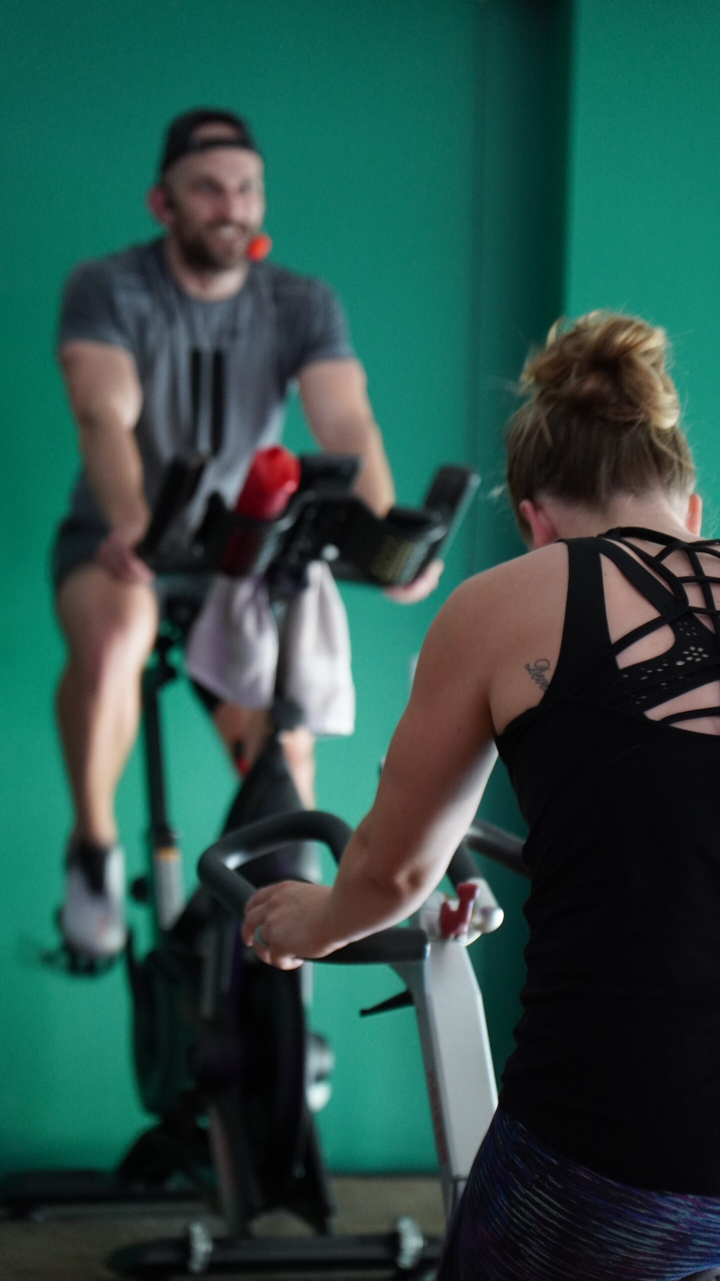 Instructor teaching cycling class 